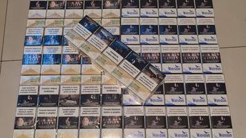 Un moldovean s-a pornit la Londra cu zeci de pachete de țigări în valiză